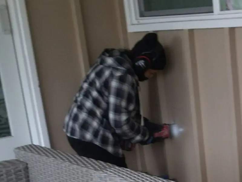 Professional electrician installing an exterior outlet in Union